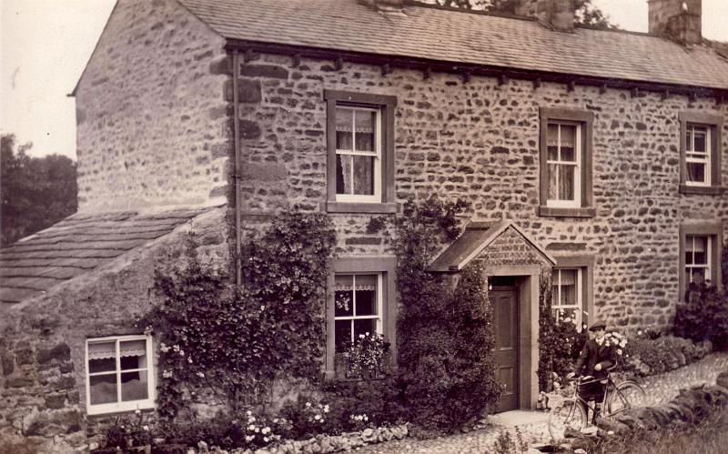Cottages on Moor Lane.JPG - Cottages on Moor Lane, with Bertie Loveridge standing by his bicycle.  ( Does anyone know the date? ) 